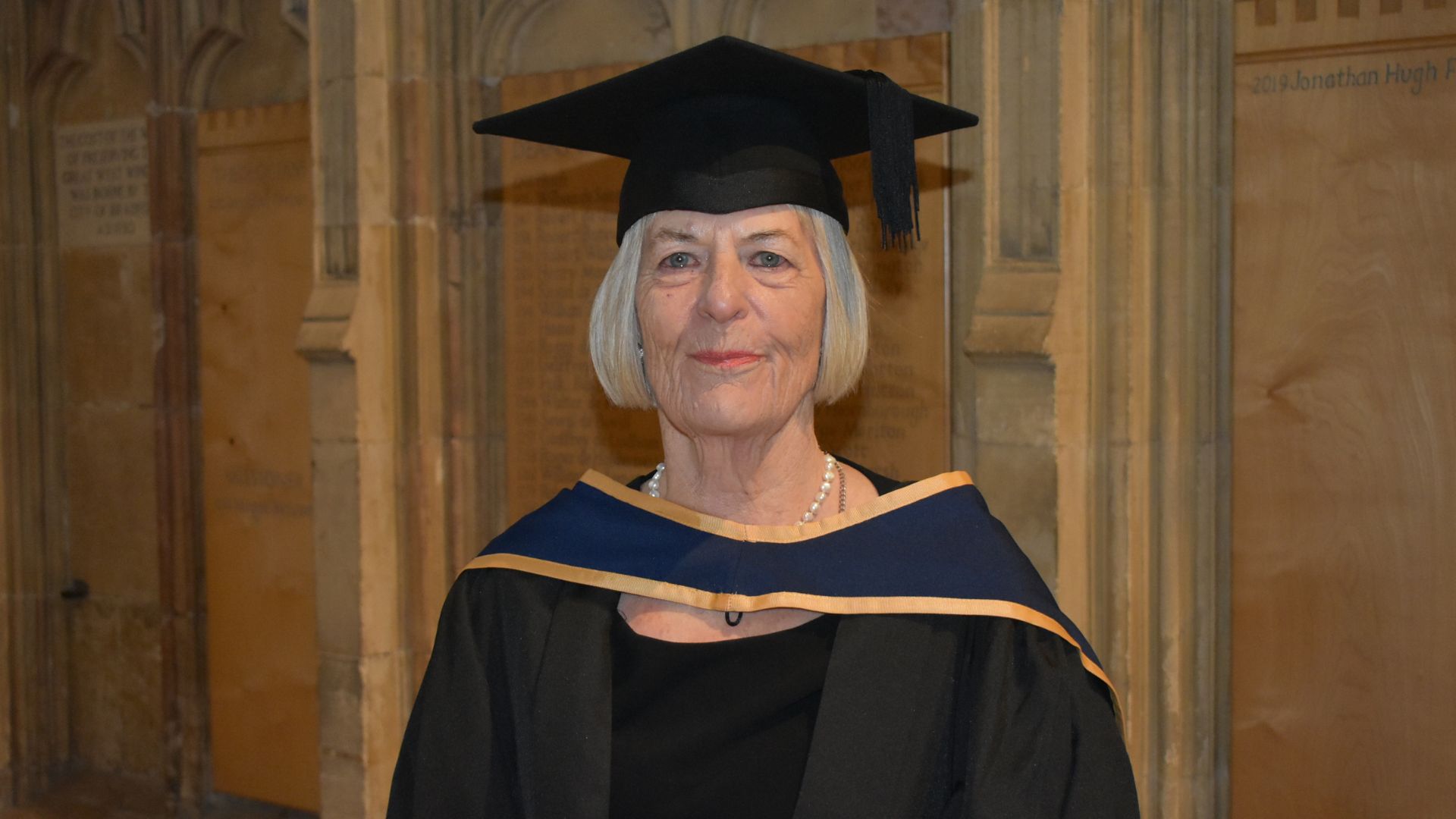 Masters student Judith Potter, age 79, in her graduation gown and mortar board