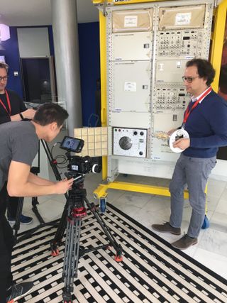 Spacecraft engineer Neil Jaschinski poses with Bake In Space's prototype microgravity oven.