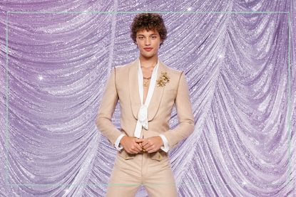 Bobby Brazier posing in front of a glittery purple background