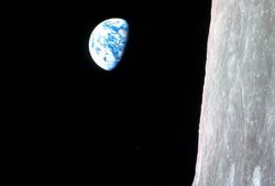 The iconic image of the Earth rising, the first of its kind taken by an astronaut from lunar orbit, greeted the Apollo 8 astronauts as they rounded the far side of the moon during their insertion burn, on Dec. 24, 1968. The photo is displayed here in its original orientation, though it is more commonly viewed with the lunar surface at the bottom of the photo.