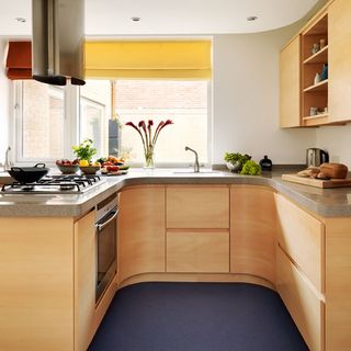 kitchen room with blue linoleum flooring and kitchen cabinets