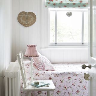 guest room with watch on white wall