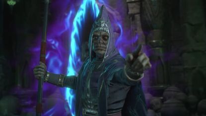 Diablo 4 hooded character holds staff and points toward screen