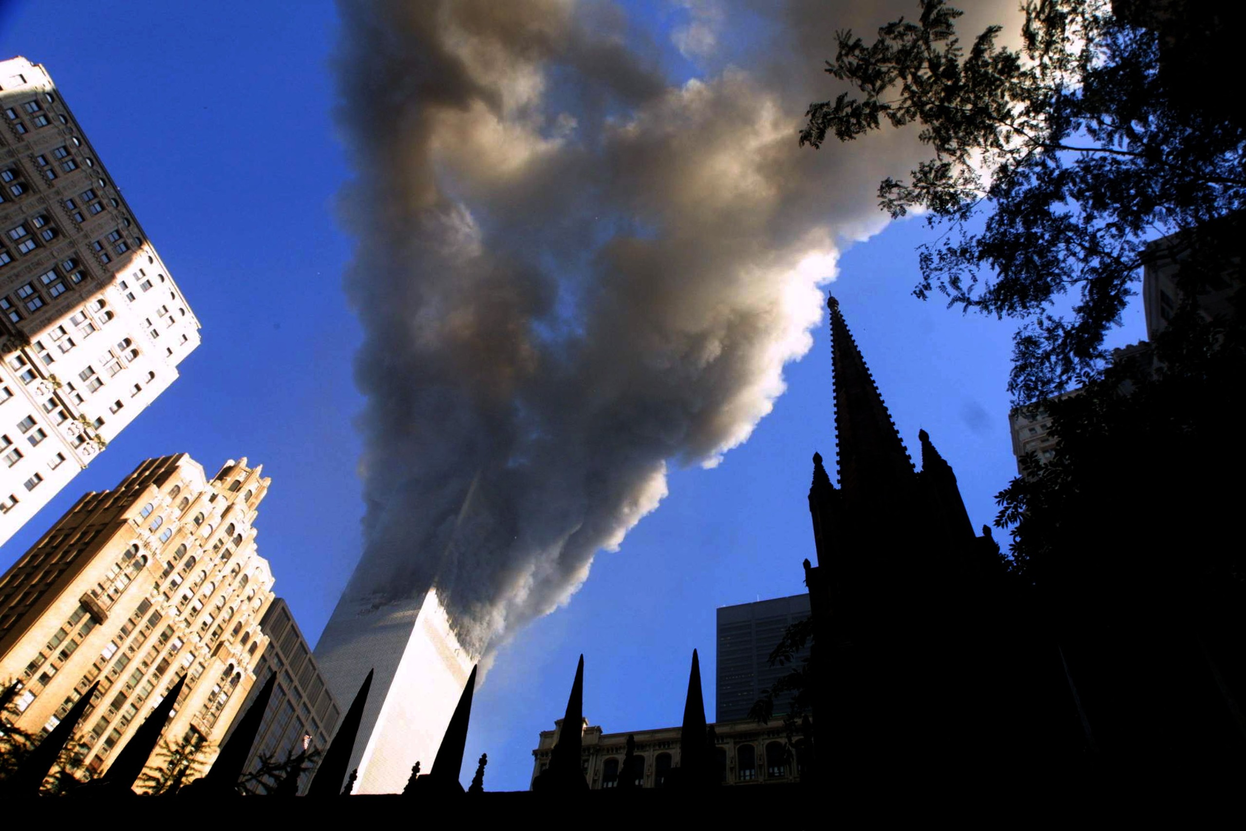 Smoke spews from the south tower of the World Trade Center September 11, 2001 after two hijacked airplanes hit the twin towers in an alleged terrorist attack on New York City.