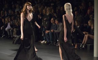 Models wearing black dresses
