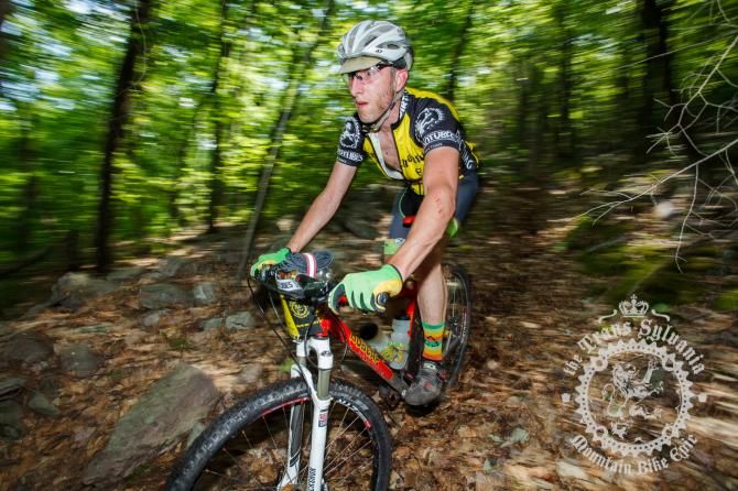Matt Ferrari picks his way through the leaf-covered rocks of an early descent.