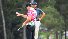 Xander Schauffele watches on as Viktor Hovland uses AimPoint