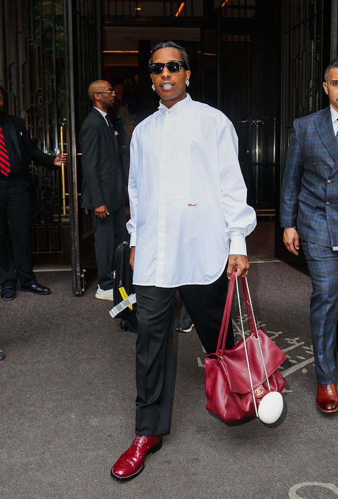 A$AP Rocky is seen out and about on June 9, 2026 in New York wearing a shirt, black trousers and red shoes