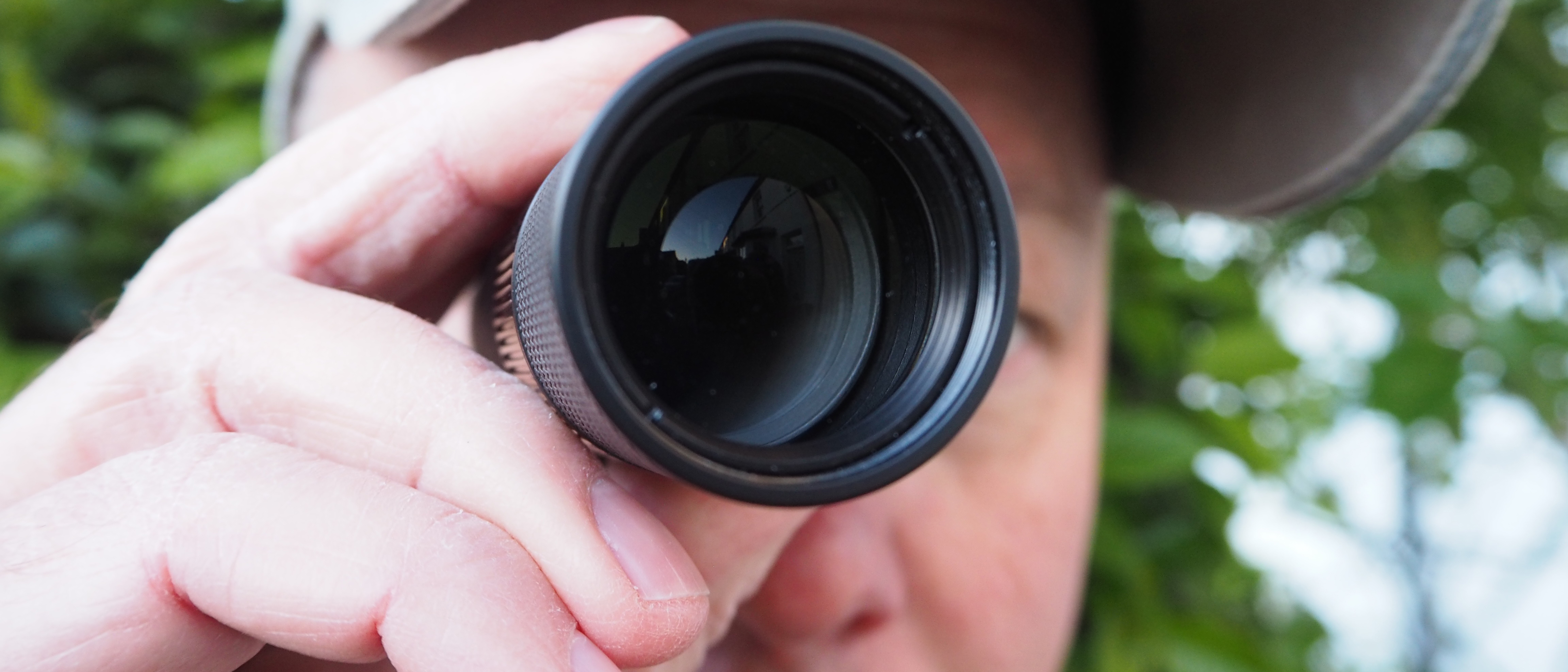 Person looking through a Leica Monovid 8x25 monocular 