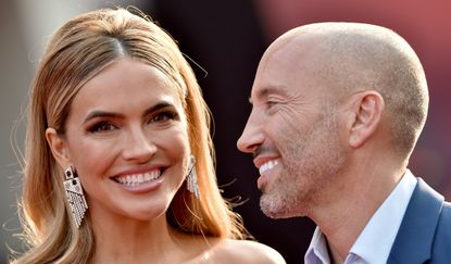 Chrishell and Jason, Chrishell Stause and Jason Oppenheim attend Disney's Premiere of "Shang-Chi and the Legend of the Ten Rings" at El Capitan Theatre on August 16, 2021 in Los Angeles, California