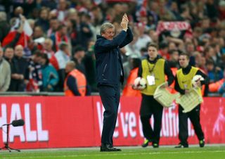 Roy Hodgson applauds England's fans after sealing World Cup qualification