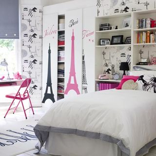 bedroom with parisian theme wallpaper and Eiffel tower graphics