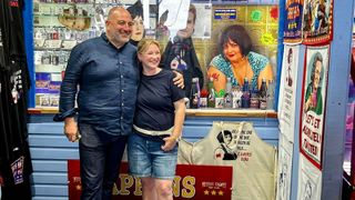 Wynne and Joanna at Nessa's Slots on Barry Island wearing t-shirts and shorts and smiling