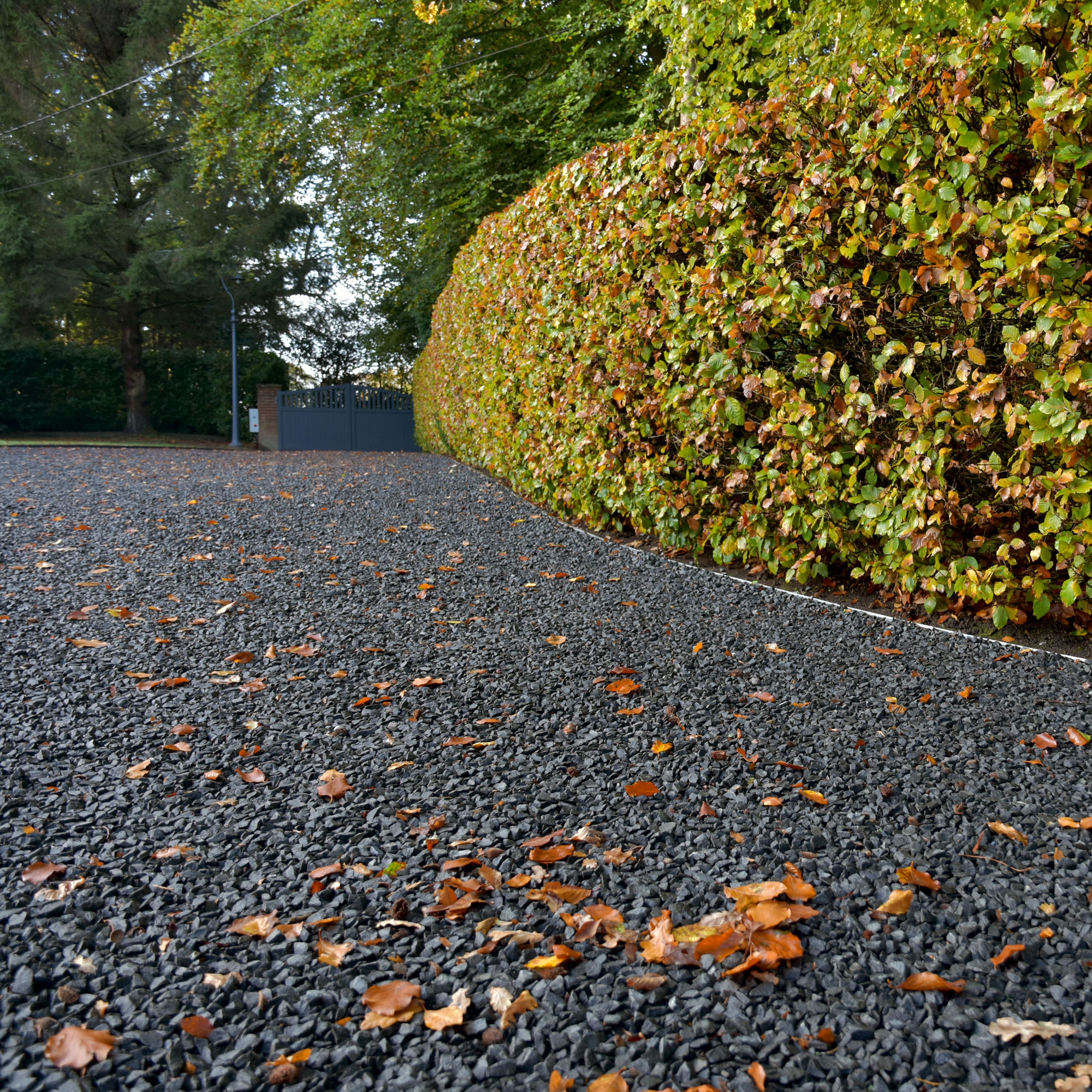 black gravel sloping driveway