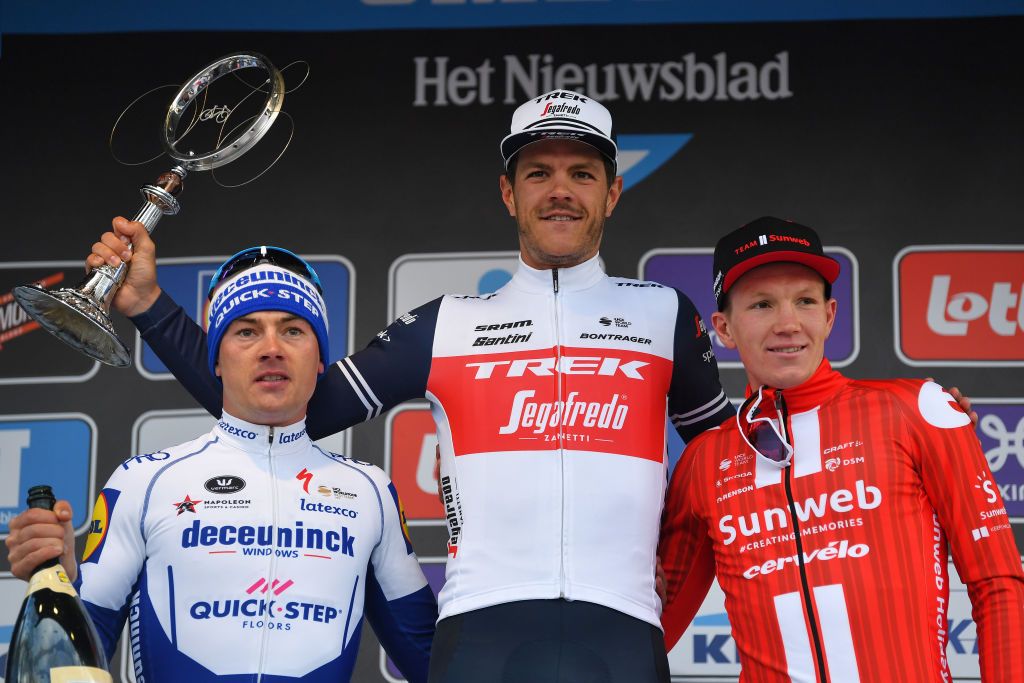 NINOVE BELGIUM FEBRUARY 29 Podium Yves Lampaert of Belgium and Team Deceuninck QuickStep Jasper Stuyven of Belgium and Team Trek Segafredo Soren Kragh Andersen of Denmark and Team Sunweb Celebration Trophy during the 75th Omloop Het Nieuwsblad 2020 Men Race a 200km race from Ghent to Ninove OmloopHNB OHN20 on February 29 2020 in Ninove Belgium Photo by Tim de WaeleGetty Images
