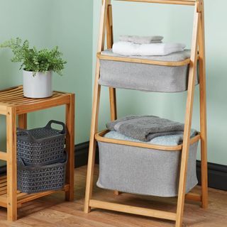 bamboo storage ladder and plant in white pot