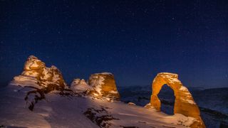 Delicate Arch at night in winter in Arches National Park in Utah. (Photo by: Jon G. Fuller/VWPics/Universal Images Group via Getty Images)