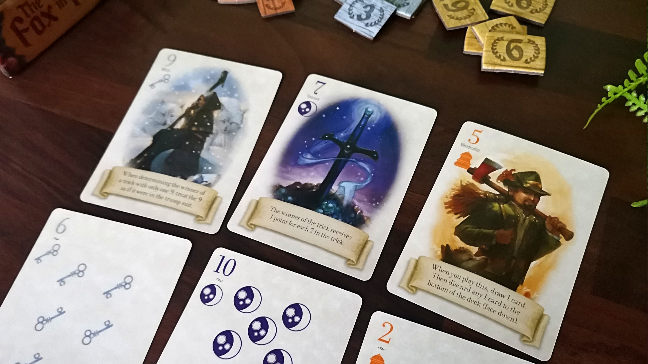Fox in the Forest cards and tokens on a wooden table