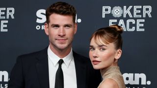 Liam Hemsworth and gabriella brooks at the poker face premiere in 2022
