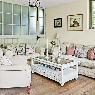 living room with wooden floor and sofa set