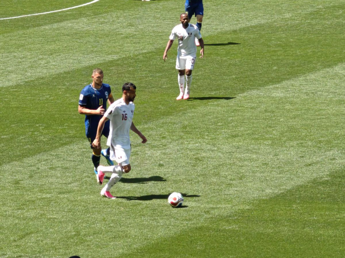 A player kicking a ball