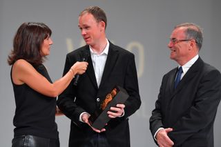 Bernard Hinault on stage with Chris Froome at the Tour de France route presentation