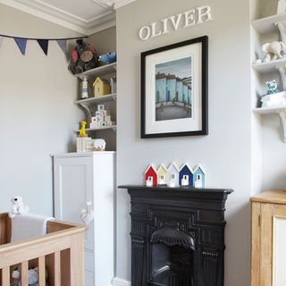 children's bedroom with fire place and wall shelf