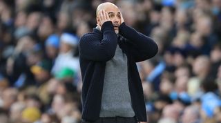 Pep Guardiola looks dejected after Manchester City concede a late equaliser to Crystal Palace in the Premier League in December 2023.