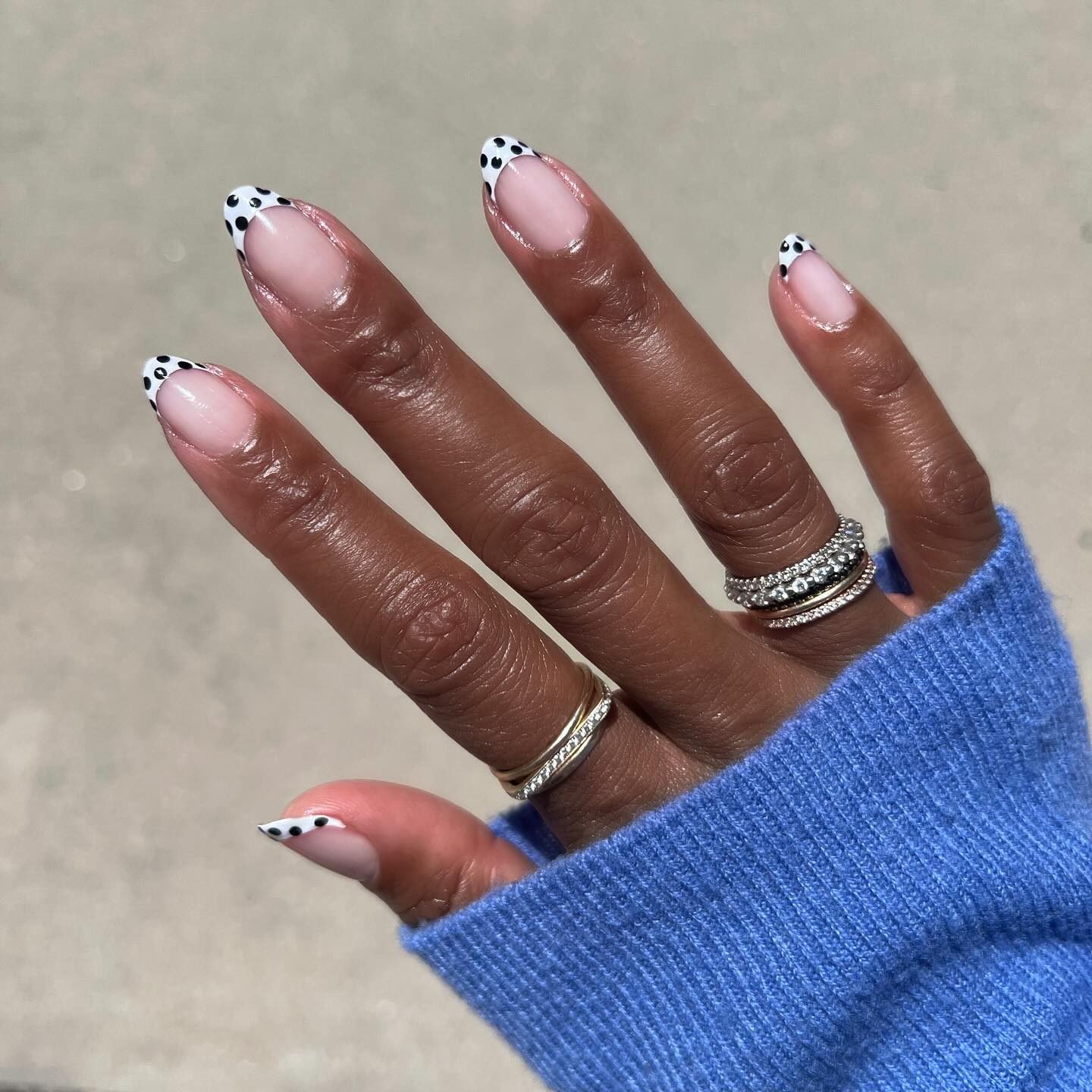 The Mani Cub black and white polka dot French tip nails