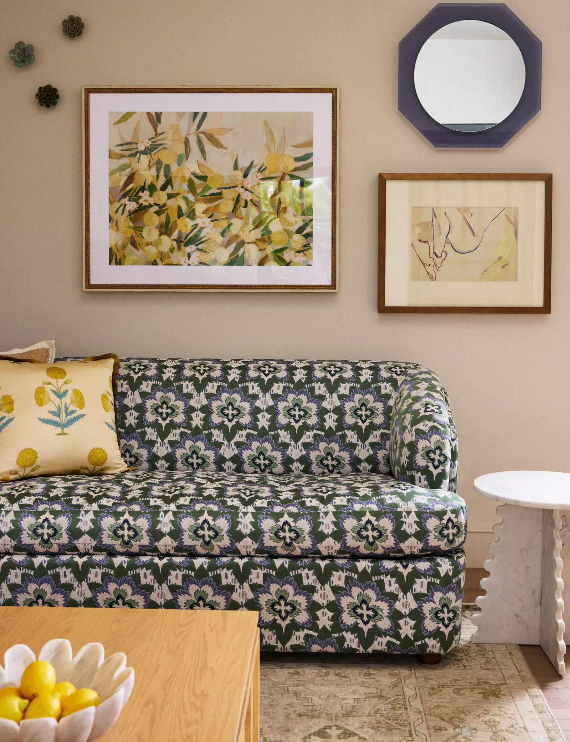 Patterned Anthropologie sleeper sofa pictured inside of a collected living room