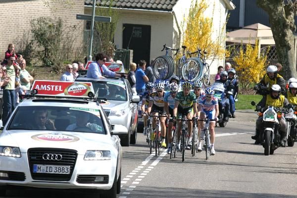 The leaders follow race director Leo van Vliet's car on a climb.