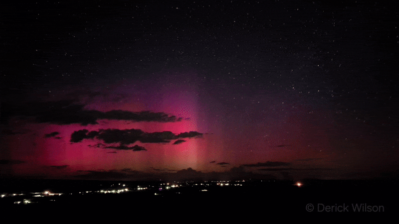 gif animation showing red auroras dancing in the sky