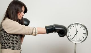 Woman boxing a clock