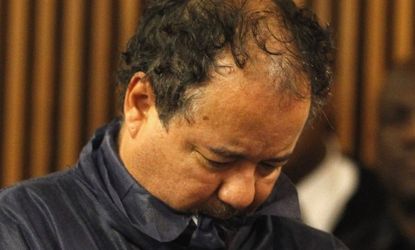 Ariel Castro stands with his head down during his arraignment on kidnapping and rape charges on May 9 in Cleveland.