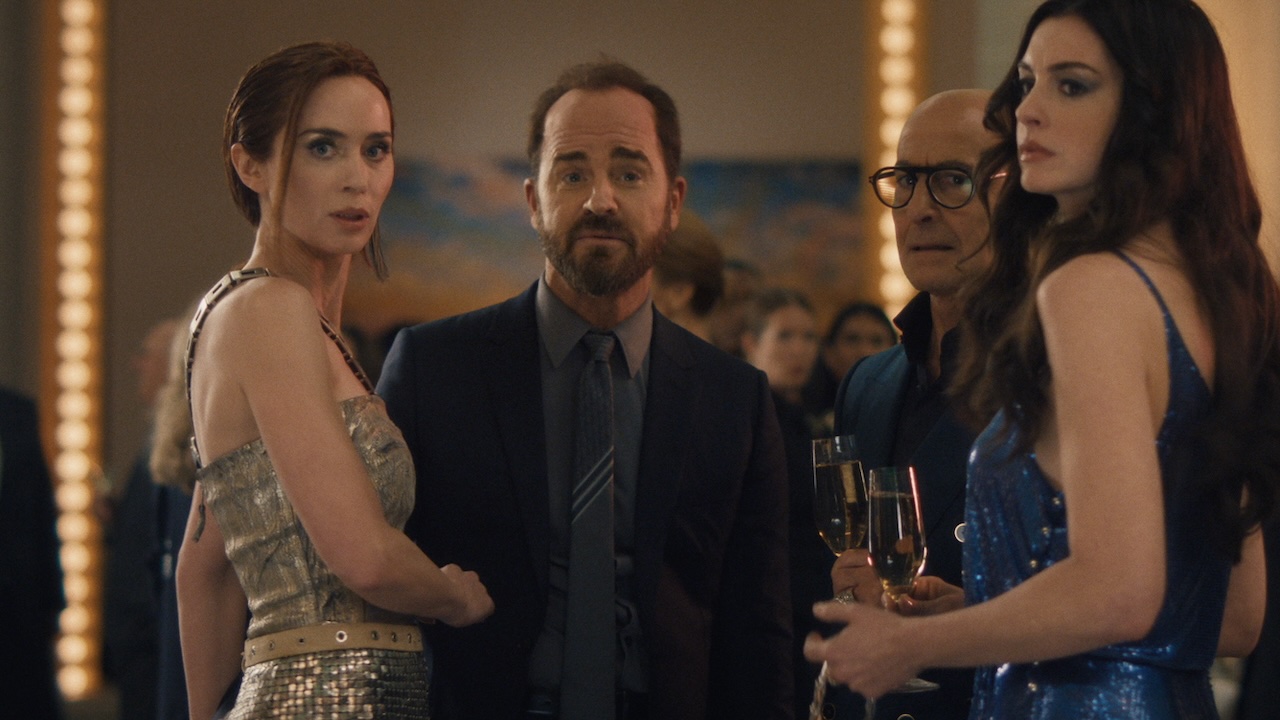 Benji and Emily standing together with Nigel and Andy in The Devil Wears Prada 2