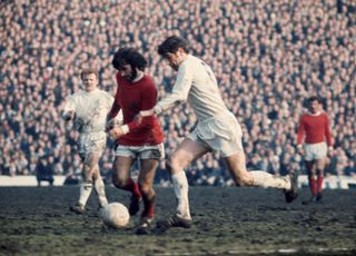 George Best is challenged by Norman Hunter in an FA Cup semi-final between Manchester United and Leeds United in March 1970.