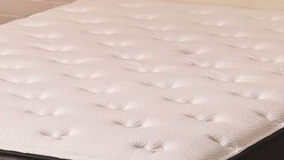 A closeup of the quilted top on the Firm side of the Plank Firm mattress