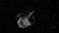 A visualization of a silvery spacecraft in a starry section of space.