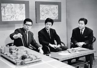 On an early day of TV, Masato Otaka presents Sakaide Artificial Ground, a social housing project on Shikoku island. Next to him, Kurokawa presents Helix City (a small model sits next to the ashtray on the table). 1963