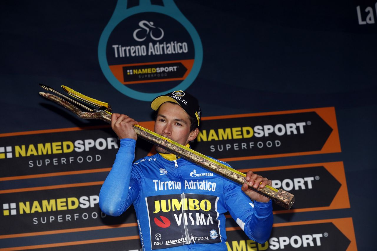 Primoz Roglic with the trident trophy