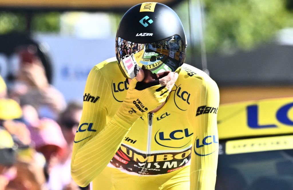 JumboVisma teams Danish rider Jonas Vingegaard wearing the overall leaders yellow jersey reacts as he cycles to the finish line during the 20th stage of the 109th edition of the Tour de France cycling race 407 km individual time trial between LacapelleMarival and Rocamadour in southwestern France on July 23 2022 Photo by AnneChristine POUJOULAT AFP Photo by ANNECHRISTINE POUJOULATAFP via Getty Images