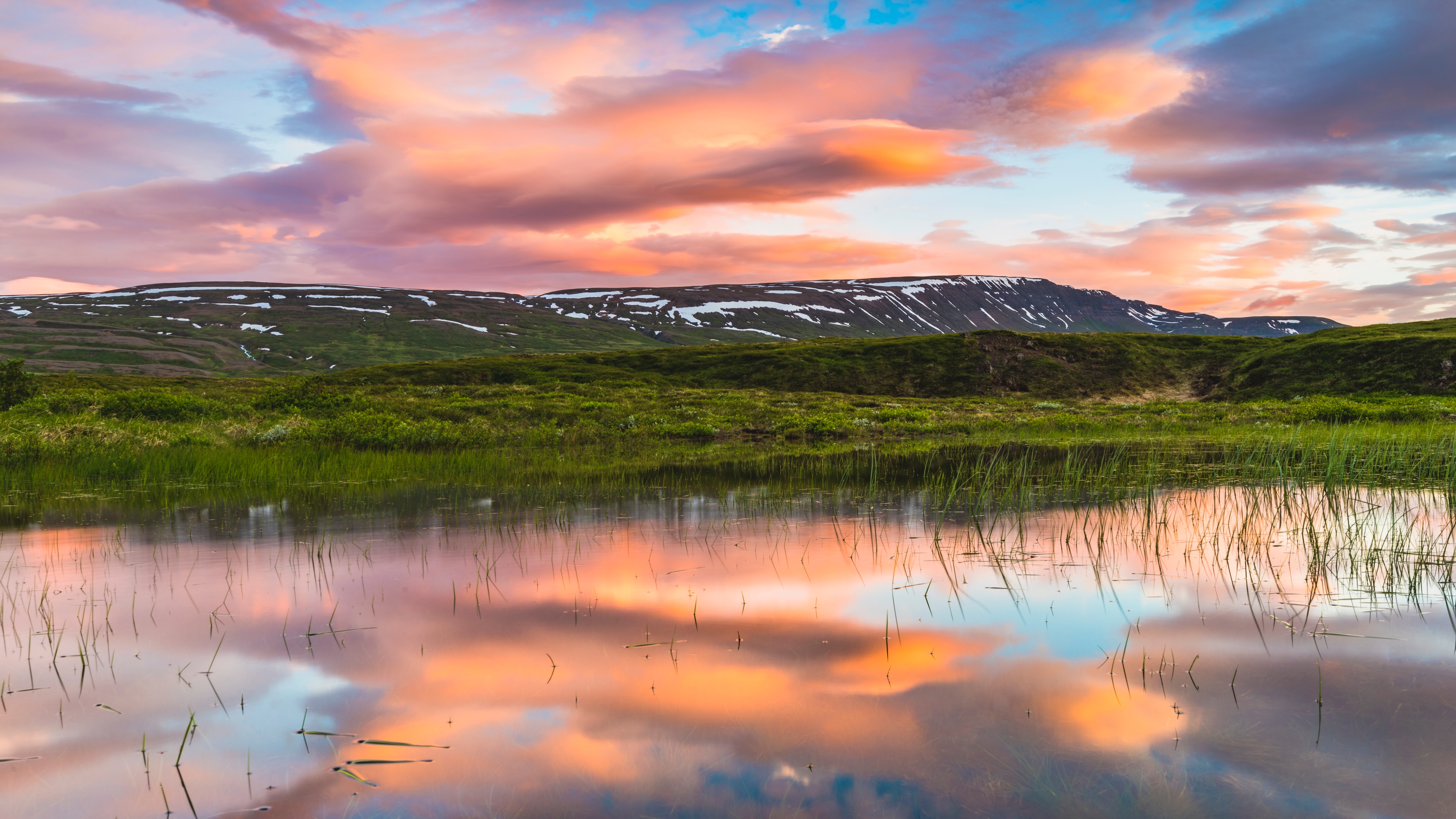 Midnight sun seen over a lake in northern Iceland
