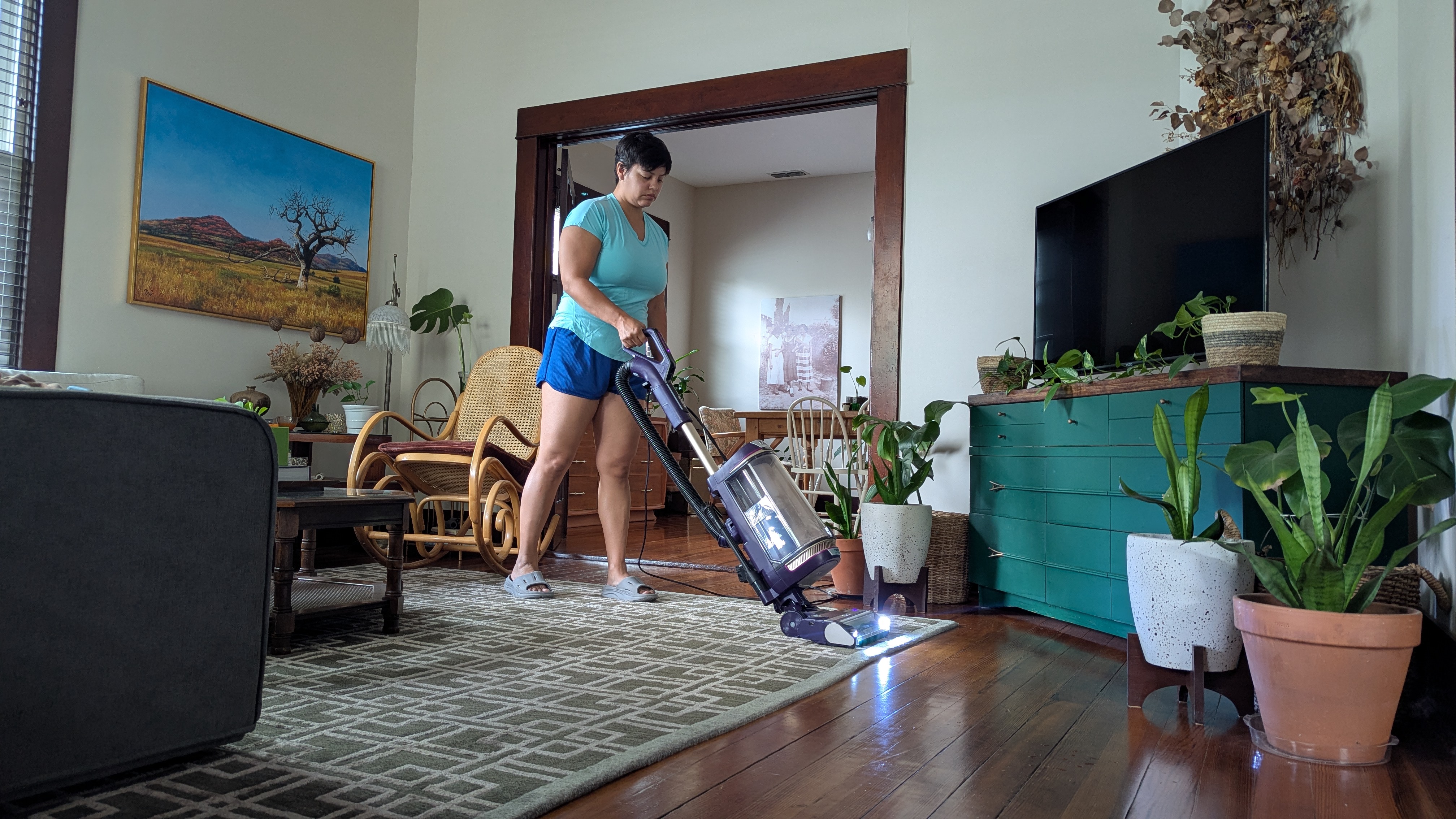 Shark PowerDetect Upright vacuum being used by reviewer in her home