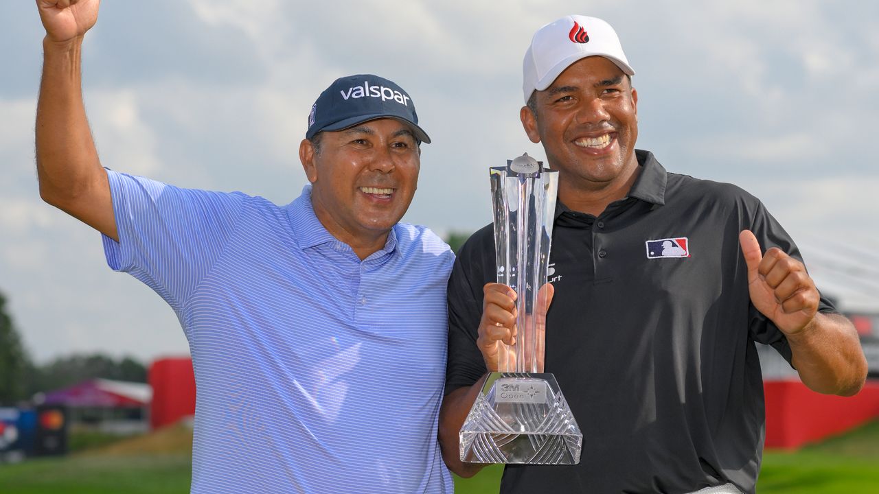 Jhonattan Vegas poses for a photo with his caddy Ruben Yorio after winning the 3M Open at TPC Twin Cities on July 27, 2024 in Blaine, Minnesota.