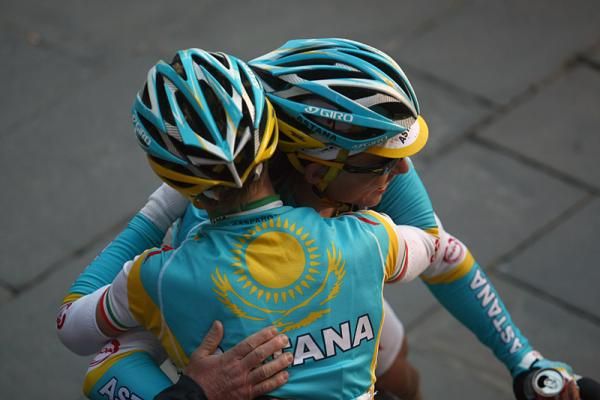 Race winner Maxim Iglinskiy is congratulated by his Astana teammate Enrico Gasparotto.
