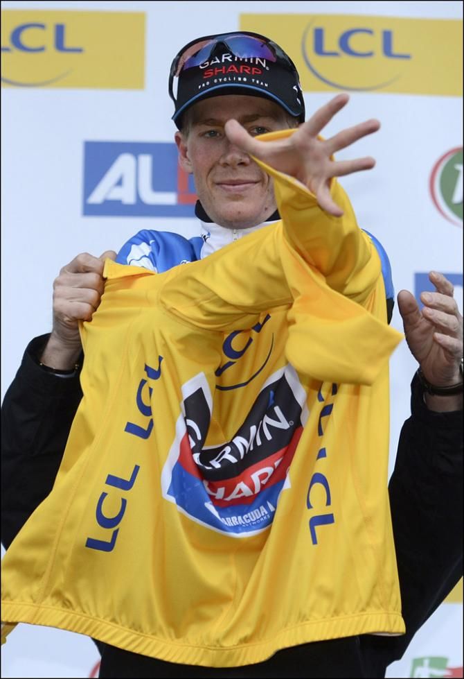 Andrew Talansky (Garmin-Sharp) puts on the leader's yellow jersey at Paris-Nice.