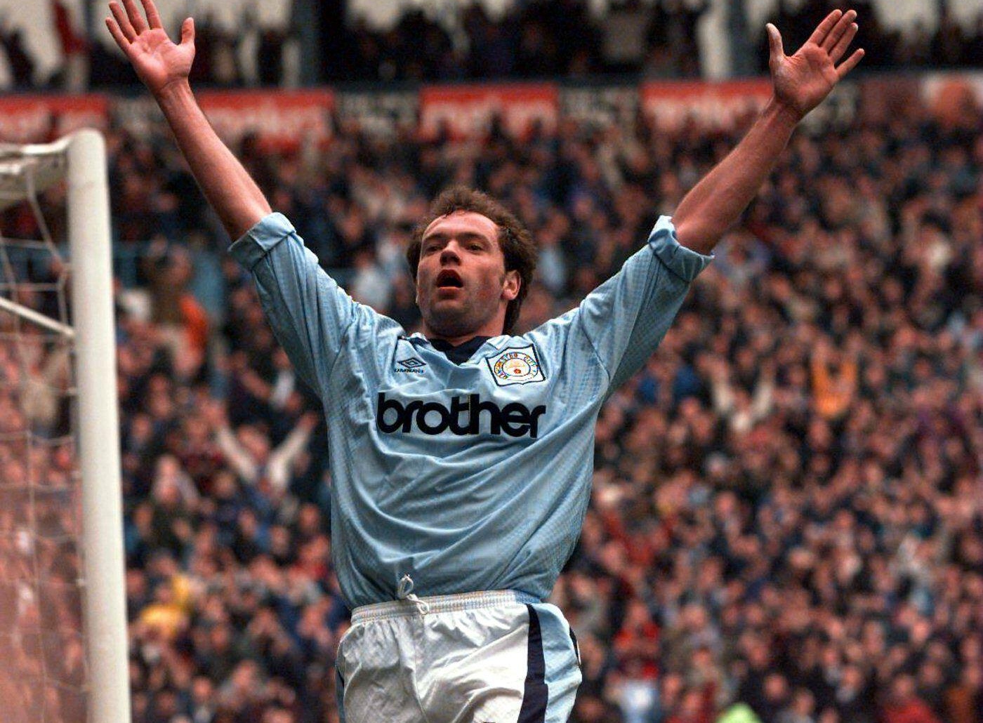 Uwe Rosler celebrates after scoring for Manchester City against Sheffield Wednesday in 1996