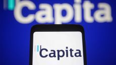 Capita logo pictured on a smartphone with branding pictured in background.