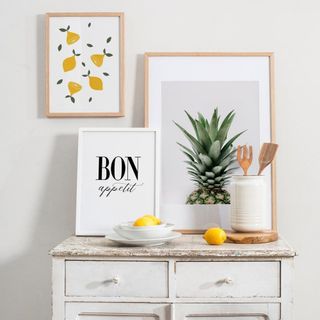 Gallery wall idea featuring fruit and typo designs in white space.
