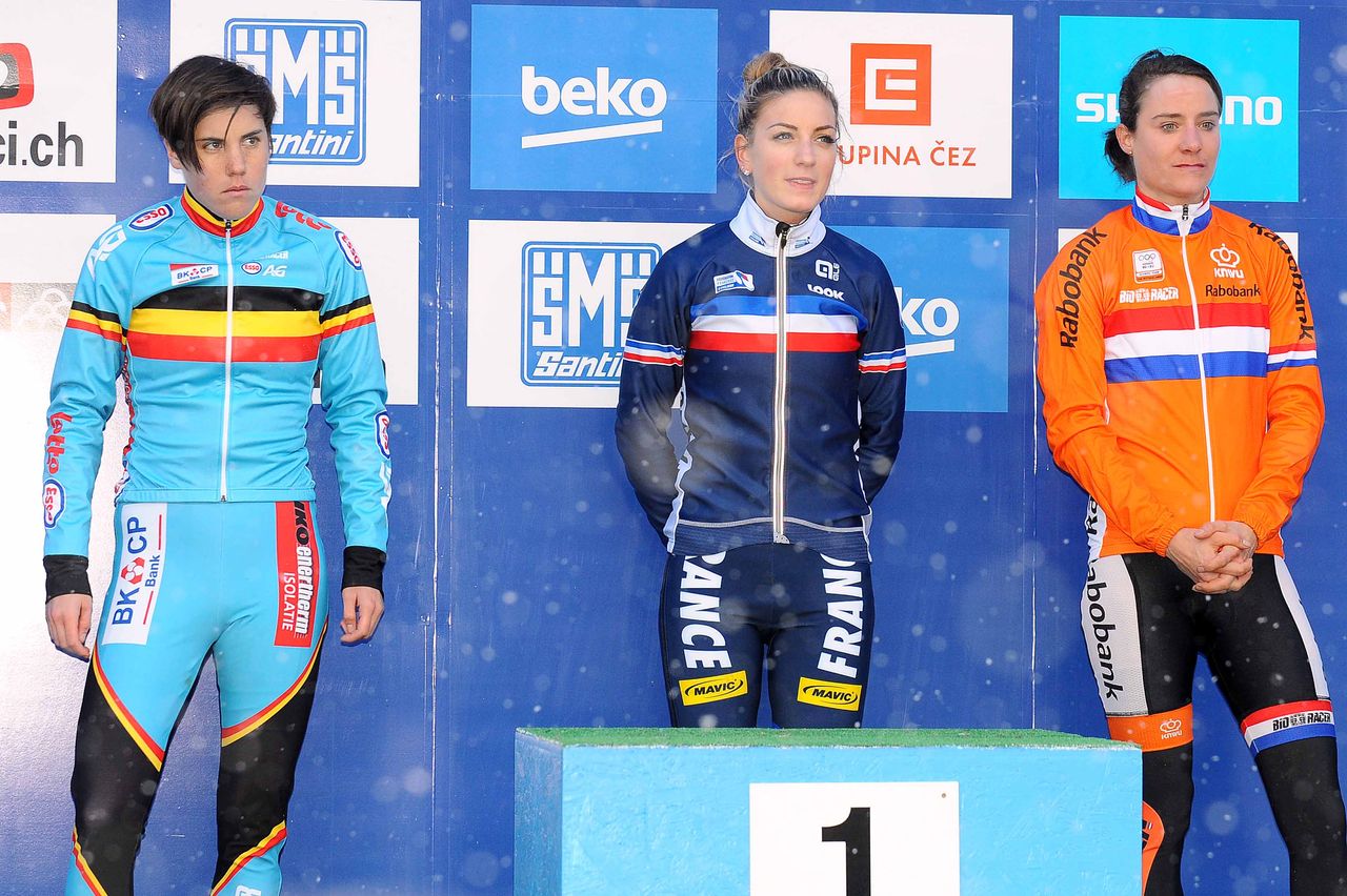 The medal winners await the podium